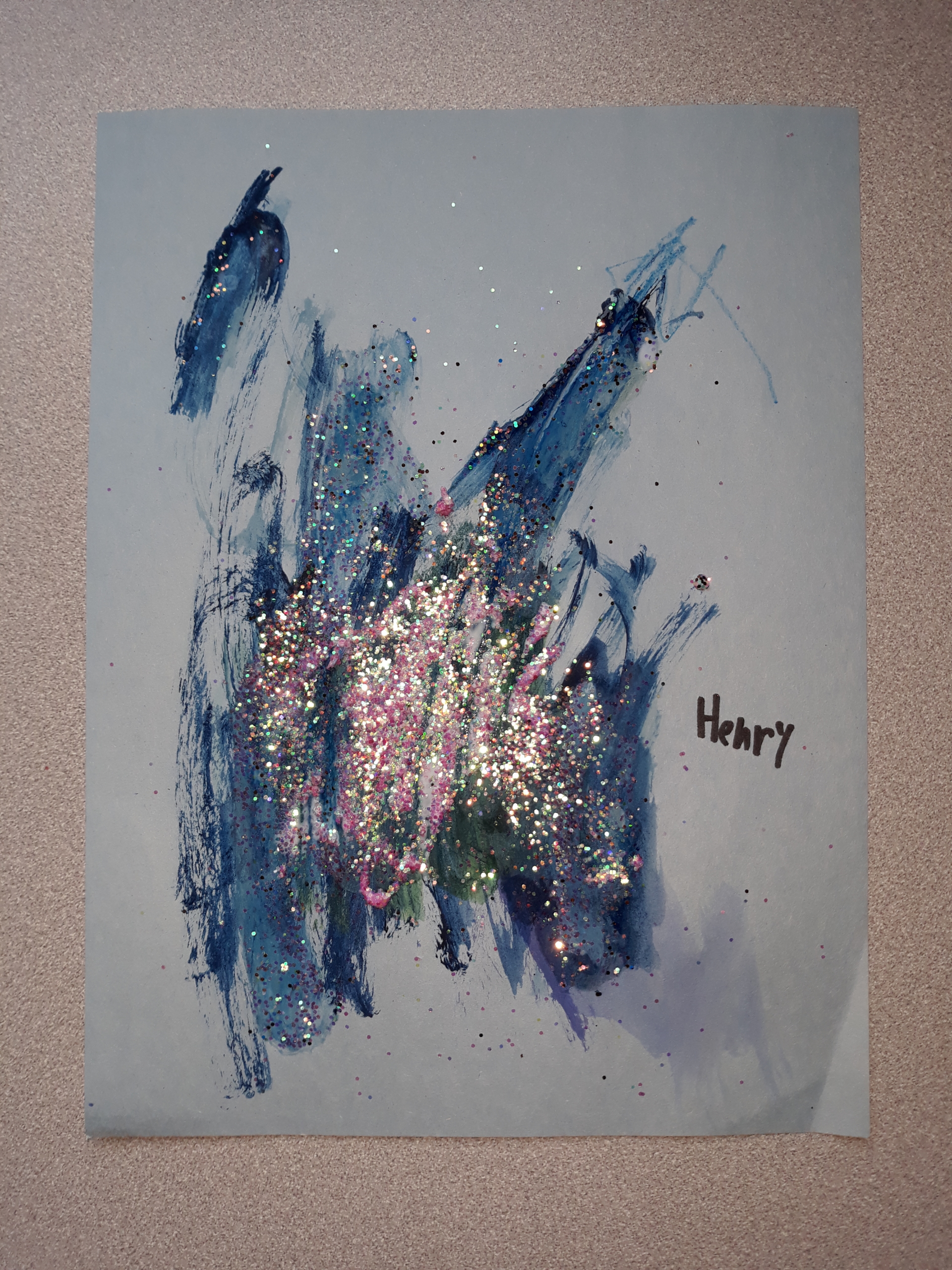 An explosion of blue and glitter fill the Space Collage of one workshop participant.