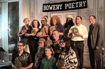 Group of NYS Teaching Artists on stage at Bowery Poetry Club accepting their tokens of esteem by City Lore's People's Hall of Fame.