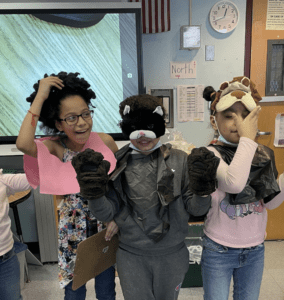 Three second-grade students in a Bronx classroom dressed in disguises