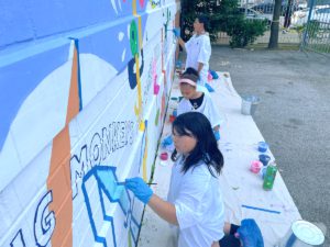 Young artists painting mural at Variety Boys & Girls Club of Queens