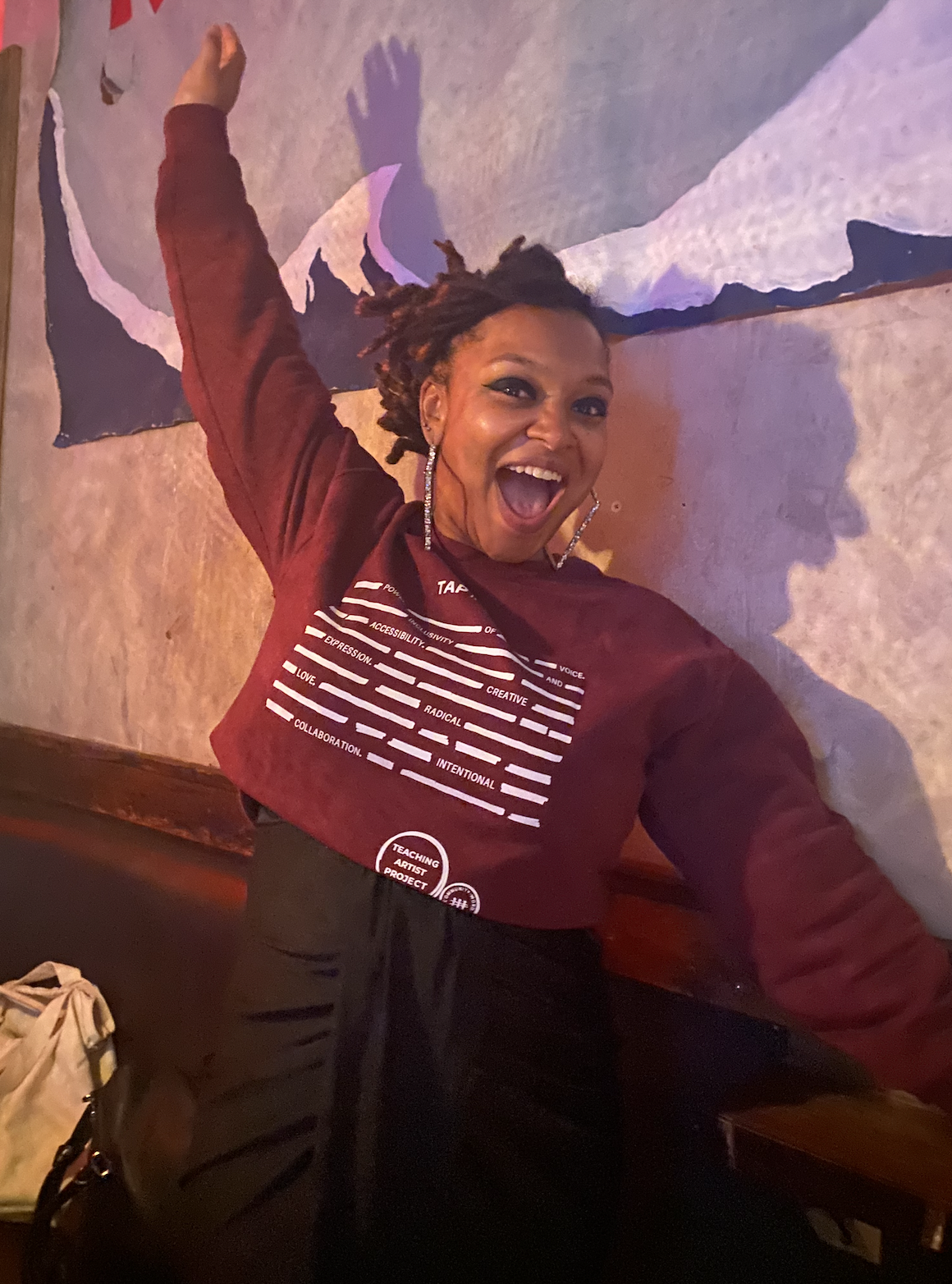 Woman showing off their custom tshirt