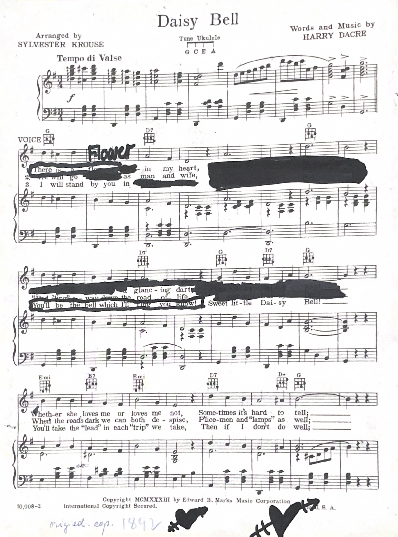 Sheet music with black ink drawing on it