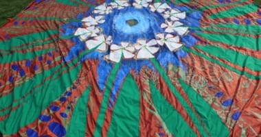 Colorful round piece of fiber art fabric