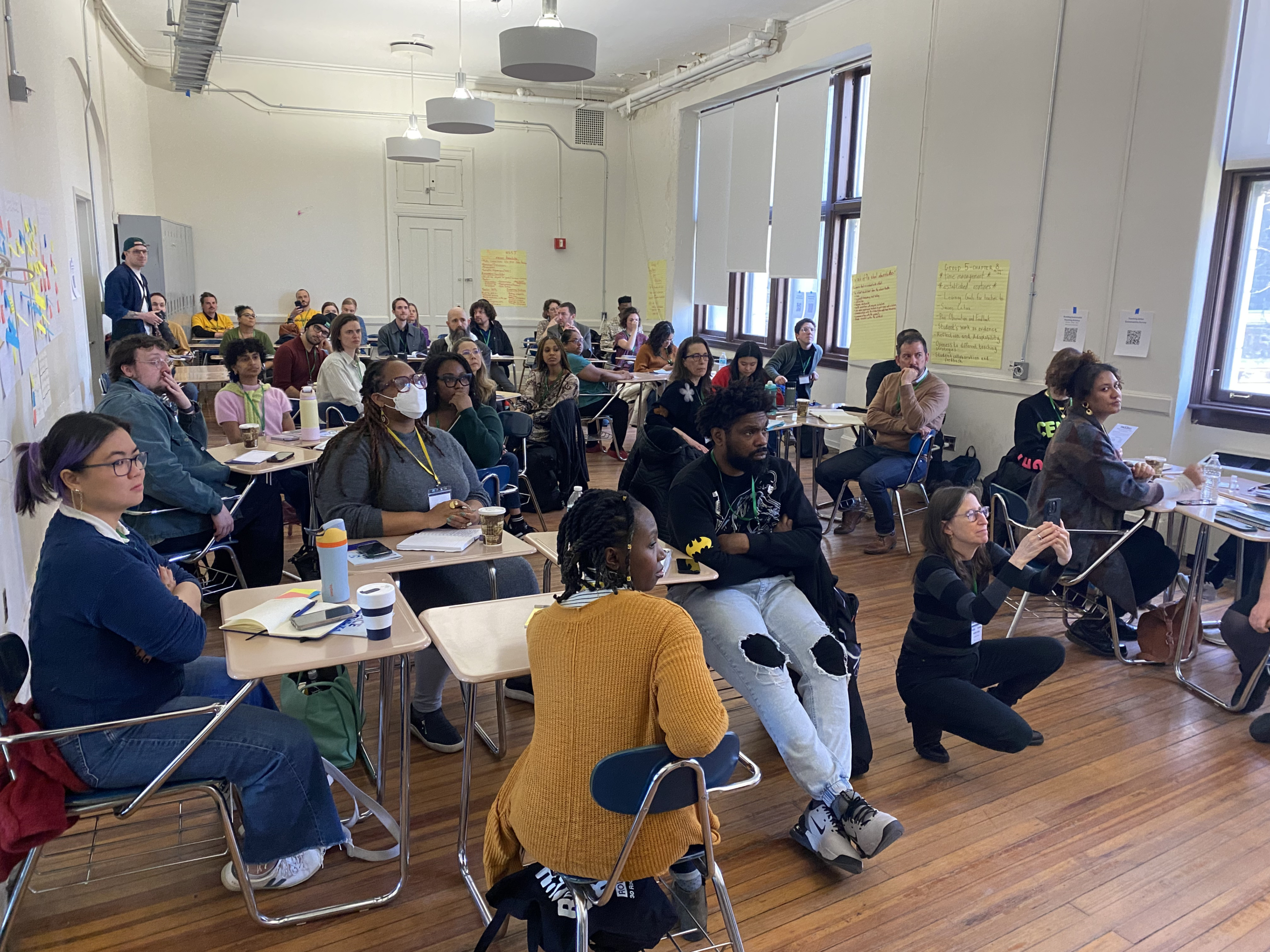 Large group of people in a conference room attending a facilitated session.