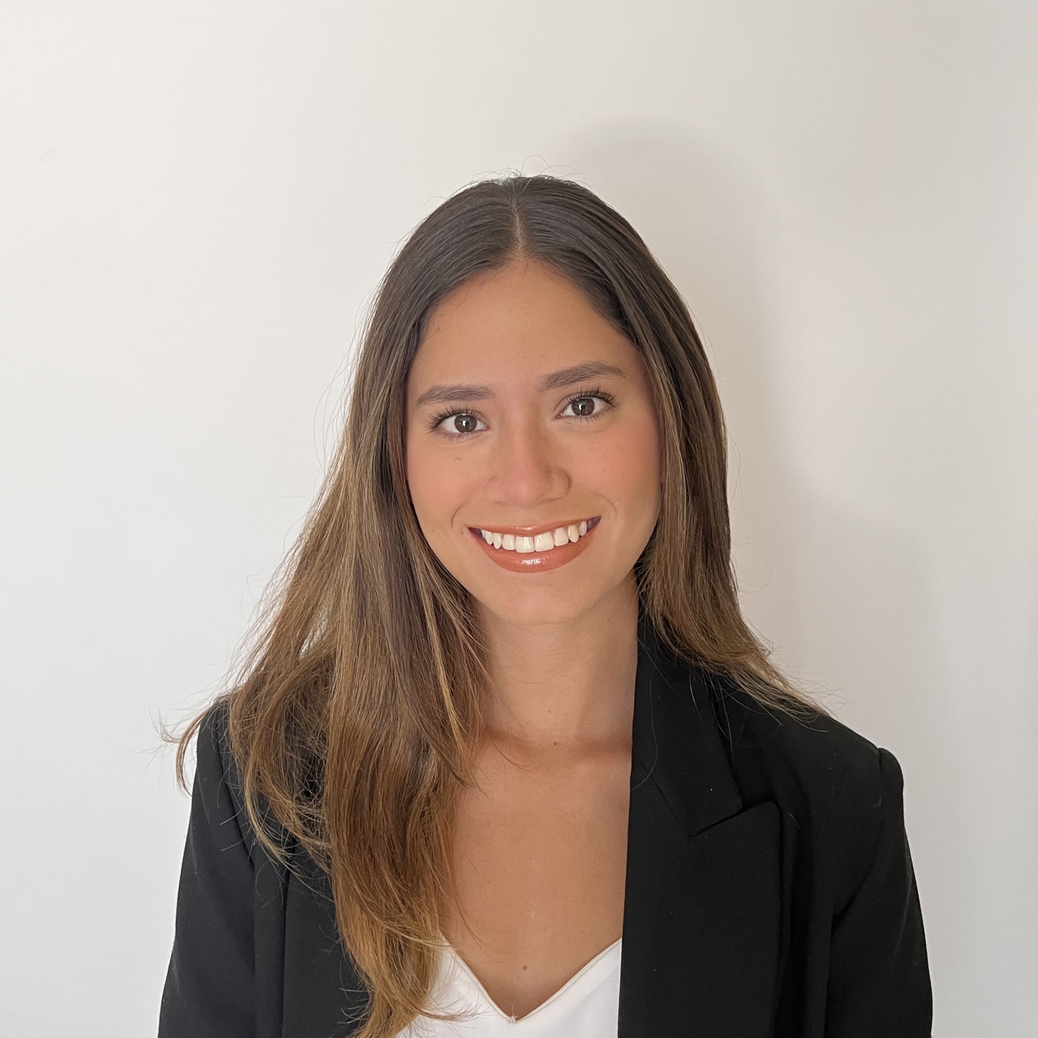 Woman smiling into camera on white background