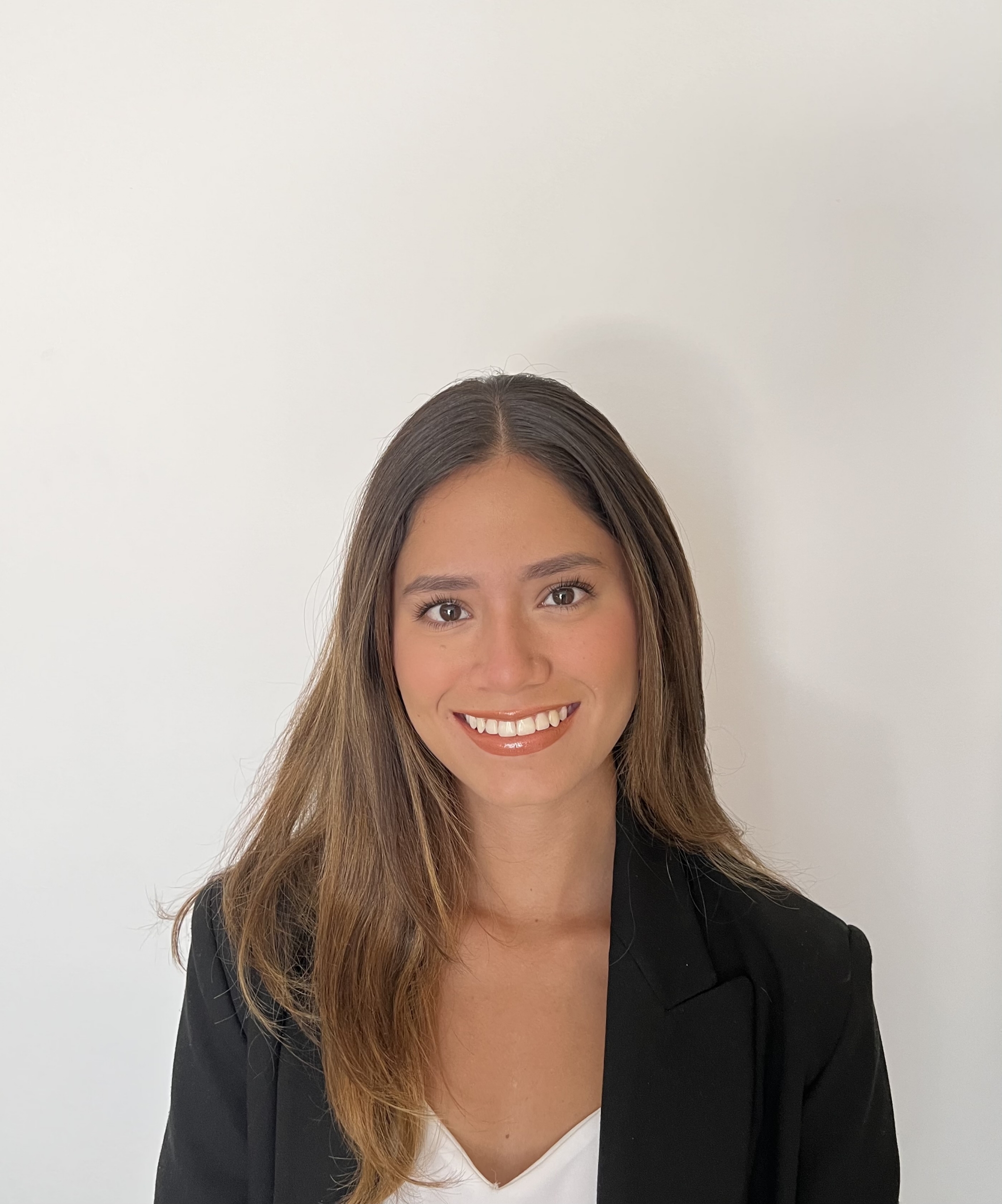 Woman smiling into camera on white background