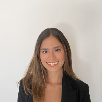 Woman smiling into camera on white background
